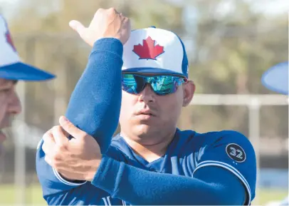  ?? CP FILE PHOTO ?? Toronto Blue Jays relief pitcher Roberto Osuna warms up at spring training on Feb. 21 in Dunedin, Fla.