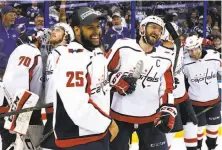  ?? Mike Carlson / Getty Images ?? Devante Smith-Pelly (25) and Alex Ovechkin celebrate after Washington beat Tampa Bay to win the East title.