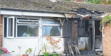  ??  ?? The scene of the fire at the bungalows in Goldwell Close, Aldington