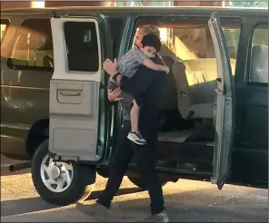  ?? COURTESY PHOTO ABBIE SOLAREZ ?? Actor Jim caviezel, portraying Homeland Security Special Agent timothy Ballard, carries Jason Solarez, 7, of Brawley in a scene being filmed for the movie “Sound of freedom,” which was shot over the weekend in calexico at the old downtown port of entry, among other locations.