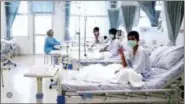  ?? THAILAND GOVERNMENT SPOKESMAN BUREAU VIA AP ?? In this image made from video, released by the Thailand Government Spokesman Bureau, three of the 12 boys are seen recovering in their hospital beds after being rescued along with their coach from a flooded cave in Mae Sai, Chiang Rai province,...