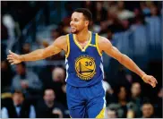  ?? AP PHOTO BY DAVID ZALUBOWSKI ?? In this 2016, file photo, Golden State Warriors guard Stephen Curry celebrates after hitting a 3-point basket and drawing a foul from the Denver Nuggets during an NBA basketball game, in Denver.