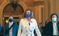  ?? ALEX BRANDON/ASSOCIATED PRESS ?? House Speaker Nancy Pelosi of California walks from the House floor Wednesday during the vote on the Democrat’s $1.9 trillion COVID-19 relief bill on Capitol Hill.