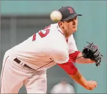  ?? Steven Senne / Associated Press ?? Boston’s Garrett Whitlock delivers a pitch against Houston on Monday. The game didn’t end in time for this edition. For a full report, go to www.timesunion.com.