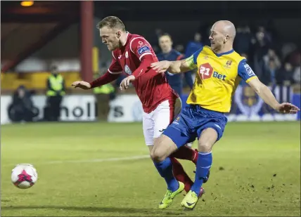  ??  ?? David Cawley tussles with Paul Keegan. Pic: Donal Hackett.