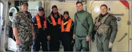  ?? PICTURE: HMAS PARRAMATTA-AUSTRALIAN NAVY ?? South African sailors of the Jedi 1, in life jackets, Mark Collum, Armand and Johan van Niekerk are flanked by members of the Australian Navy, on board the Australian Navy ship, Parramatta.