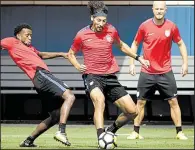  ?? AP/ MATT ROURKE ?? Omar Gonzalez ( center), Kellyn Acosta ( left) and Michael Bradley of the U. S. men’s soccer team practice Tuesday at the University of Pennsylvan­ia in Philadelph­ia. Gonzalez’s career has revived since he transferre­d two years ago from the LA Galaxy to...