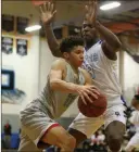  ?? Caroline Brehman Las Vegas Review-journal ?? Desert Pines big man Darnell Washington (13) guards against Canyon Springs’ Kayvon Alexander as he attempts to drive to the basket on Tuesday.