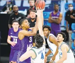  ?? Mark Humphrey Associated Press ?? UCLA’S Jaime Jaquez Jr. (4) led a defense that kept Joe Pleasant and Abilene Christian scoreless for more than nine minutes in a second-round game.