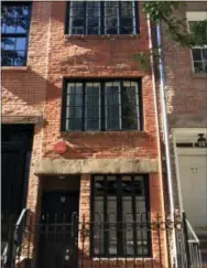  ?? BETH J. HARPAZ — THE ASSOCIATED PRESS ?? This photo shows a building at 75½ Bedford St. in Greenwich Village in New York once occupied by Edna St. Vincent Millay, a Pulitzer Prize-winning poet. It’s often referred to as the narrowest house in the city at just 9½ feet wide. It was built in 1873.