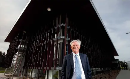  ??  ?? Philip Burdon, co-founder and shareholde­r of Meadow Mushrooms, in front of the company’s new office building at its Hornby plant in 2015.