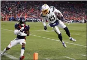  ?? DAVID ZALUBOWSKI — THE ASSOCIATED PRESS ?? Denver safety Will Parks, left, attempting to tackle Chargers wide receiver Keenan Allen in a game in December, returned to his native Philadelph­ia on a oneyear contract with the Eagles Saturday.