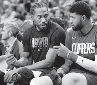  ?? DARREN ABATE AP ?? Kawhi Leonard (left) and Paul George came to Los Angeles to lead the Clippers to an NBA title, but it ended up a miserable failure last season. They are looking to right the ship this season.