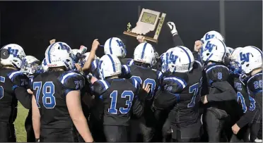  ?? PILOT PHOTO/ROBERT KRIZMANICH ?? Laville’s Lancers hold up the sectional trophy after holding Pioneer scoreless Friday night.