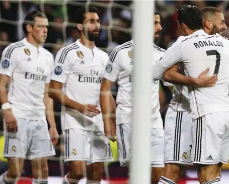  ??  ?? Real Madrid players celebratin­g the quarter final ticket... last night