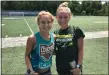  ?? MARK PODOLSKI — THE NEWS-HERALD ?? Gilmour grad sisters Alanna, right, and Caitrina Barton after a June 16workout at Mayfield’s Wildcat Stadium.