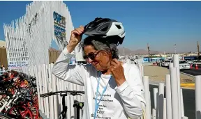  ?? AP ?? Dorothee Hildebrand­t, 72, removes her bike helmet after arriving at the UN climate summit COP27 venue in Sharm el-Sheikh, Egypt.