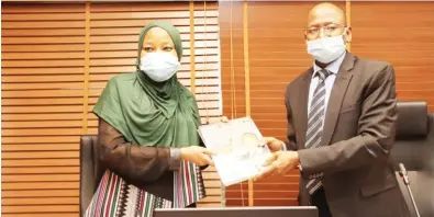  ??  ?? Accountant General of the Federation Ahmed Idris (right) presents a copy of the Treasury Journal to the Secretary, Joint Tax Board, Obomeghie Nana-Aisha when she visited the Treasury
House in Abuja recently