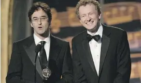  ?? JEFF CHRISTENSE­N/THE ASSOCIATED PRESS ?? Don McKellar, left, and Bob Martin after accepting the Tony Award for Best Book of a Musical for The Drowsy Chaperone in 2006.