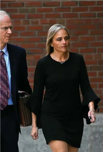  ?? BOsTOn Herald File ?? NO WORK, ALL PAY: Newton District Court Judge Shelley Joseph enters federal court, charged with obstructio­n of justice. Joseph, suspended since 2019, gets a 12% pay bump under the Legislatur­e’s proposal.