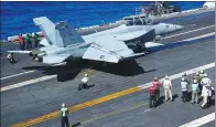  ??  ?? An F-18 Hornet fighter jet prepares to take off from the flight deck Carl Vinson on Feb 14.