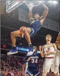  ?? ?? Jackson State forward Jayveous McKinnis dunks during a road game against Iowa State on Dec. 12.