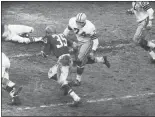  ?? THE ASSOCIATED PRESS FILE ?? Eagles rookie back Ted Dean (35), heads for a big hole and a touchdown in the fourth quarter of the NFL championsh­ip game against the Green Bay Packers on Dec. 26, 1960, at Franklin Field.