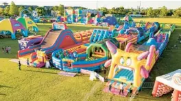  ?? BIG BOUNCE AMERICA ?? Now covering an area of over 24,000 sq. ft. and standing 32 ft. tall at its highest point, this inflatable goliath is The World’s Largest Bounce House.