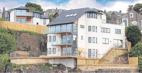  ?? Pictures: Savills. ?? Gillian Bayford’s property on a rocky outcrop is built on four storeys and has several balconies.