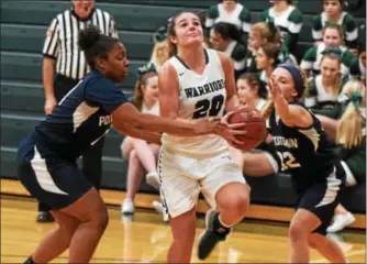  ?? AUSTIN HERTZOG - DIGITAL FIRST MEDIA ?? Methacton’s Sydney Tornetta, center, tries to drive through Pottstown’s Ebony Reddick, left, and Gianna Epps during the second half Tuesday.