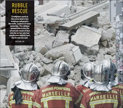  ??  ?? Firefighte­rs work at the scene where two buildings collapsed in Marseille, southern France, yesterday. The collapse spewed debris into the street and clouds of dust into the air but only two people were slightly hurt, the fire service said.