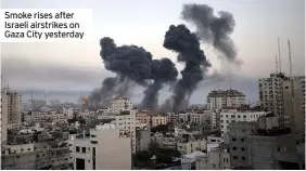  ??  ?? Smoke rises after Israeli airstrikes on Gaza City yesterday