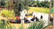  ??  ?? Members of the Trinidad and Tobago Defence Force and Red Cross help residents trapped by rising floodwater­s in St Helena, Piarco.