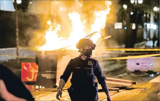  ?? NATHAN HOWARD / AFP ?? El tiroteo a manos de la policía de un sintecho provocó disturbios en las calles de Portland la noche del viernes