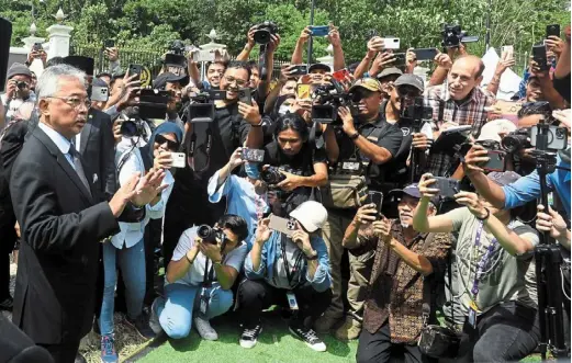  ?? — azhar mahfof/ The star ?? Centre of attention: sultan abdullah addressing members of the media outside Istana negara in Kuala Lumpur.