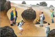  ?? ZHU XINGXIN / CHINA DAILY ?? Tourists from the Chinese mainland visit the Yehliu Geopark in Taiwan’s New Taipei City in May.