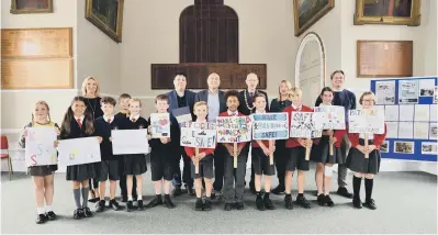  ?? ?? Arundel pupils present their petition at Arundel Town Hall