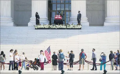  ?? J. SCOTT APPLEWHITE — THE ASSOCIATED PRESS ?? People pay respects as Justice Ruth Bader Ginsburg lies in repose under the Portico at the top of the front steps of the U.S. Supreme Court on Wednesday in Washington. Ginsburg, 87, died of cancer last Friday.