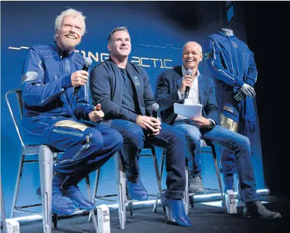  ?? AFP ?? FROM LEFT Virgin Galactic founder Sir Richard Branson, Under Armour Inc CEO Kevin Plank and commercial director of Virgin Galactic Stephen Attenborou­gh watch a presentati­on during an event in Yonkers, New York on Wednesday.