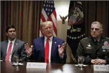  ?? CAROLYN KASTER — THE ASSOCIATED PRESS ?? President Donald Trump, joined by from left, Defense Secretary Mark Esper, and Chairman of the Joint Chiefs of Staff Gen. Mark Milley, speaks to media during a briefing with senior military leaders in the Cabinet Room at the White House in Washington, Monday.