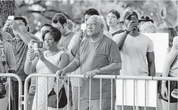  ?? Eric Gay / Associated Press ?? Onlookers watch as a statue of Confederat­e President Jefferson Davis is removed from its place on the University of Texas campus in Austin. The statue, which has come under increasing criticism, will be placed in the school’s Dolph Briscoe Center for...