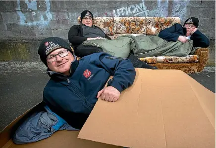  ??  ?? The Salvation Army’s Peter Barton, front, with Kat Eden and Captain Michelle Lee, test out sleeping arrangemen­ts in preparatio­n for 14 hours Homeless.