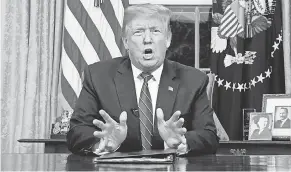  ?? CARLOS BARRIA/AP ?? President Donald Trump makes his case for border wall funding in a prime-time address Tuesday from the Oval Office.