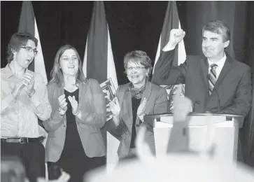  ?? MIKE DEMBECK/THE CANADIAN PRESS ?? Nova Scotia Liberal Leader Stephen McNeil raises his hand in victory at his campaign headquarte­rs in Bridgetown. The Liberals won a majority, defeating Darrell Dexter and the ruling NDP party, which finished third behind the PCs.