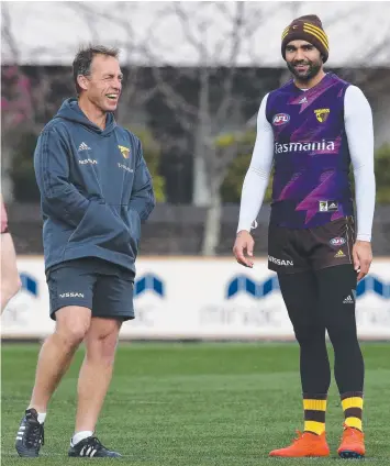  ?? Picture: MICHAEL KLEIN ?? INFLUENCER­S: Hawthorn coach Alastair Clarkson chats with record-breaking veteran Shaun Burgoyne at Hawks training yesterday.