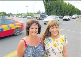  ?? PICTURE / PETER DE GRAAF ?? GRATEFUL: Mandy Turner (Waipapa Business Associatio­n, left) and Cr Ann Court are delighted that the Waipapa roundabout is to be built after decades of lobbying.