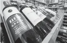  ??  ?? Bottles of B.C. wine on display at a liquor store in Cremona, Alta.