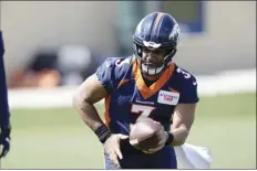  ?? AP file photos ?? Broncos quarterbac­k Russell Wilson takes part in drills at the team’s voluntary veteran minicamp on April 27.