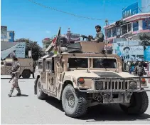  ?? AFP/GETTY IMAGES ?? Afghan security forces stand guard in Kunduz on Tuesday.