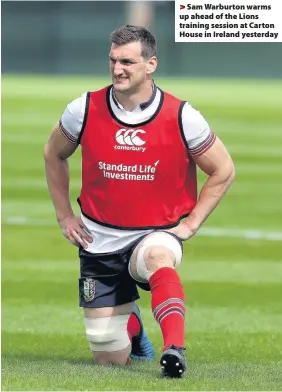  ??  ?? > Sam Warburton warms up ahead of the Lions training session at Carton House in Ireland yesterday